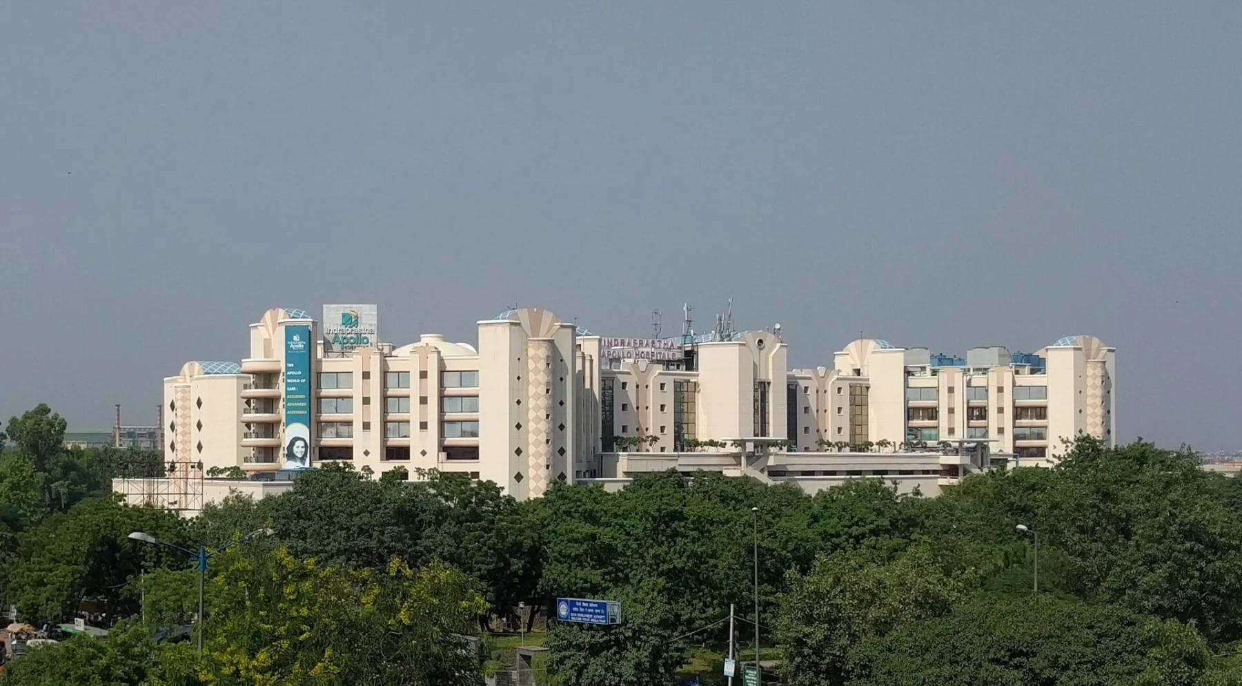 Indraprastha Apollo Hospital building in New Delhi surrounded by trees